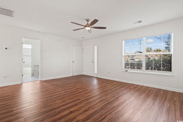 empty room featuring dark hardwood / wood-style floors and ceiling fan