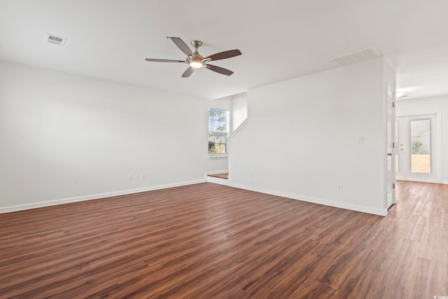 unfurnished room featuring ceiling fan and dark wood-type flooring