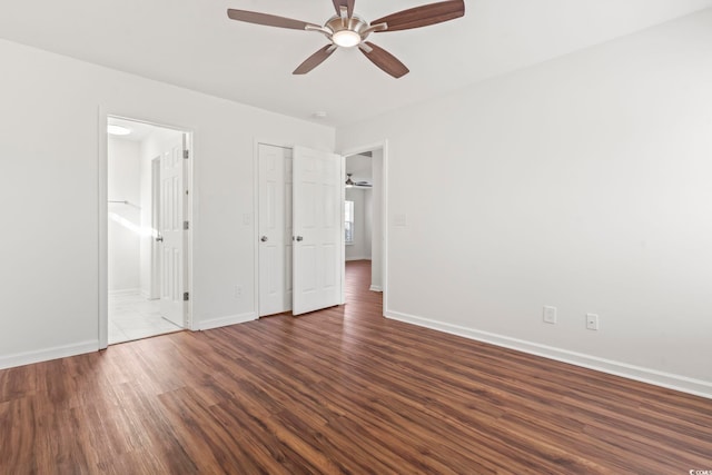 unfurnished bedroom featuring dark hardwood / wood-style floors, ceiling fan, and ensuite bathroom