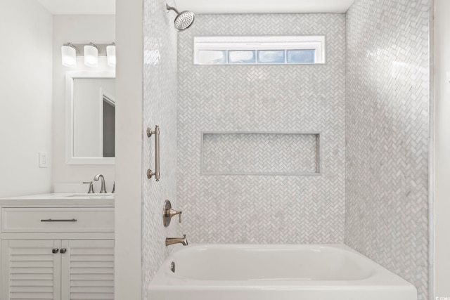 bathroom with vanity and tiled shower / bath