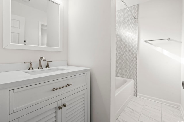 bathroom with vanity and tiled shower / bath