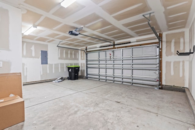 garage with electric panel and a garage door opener