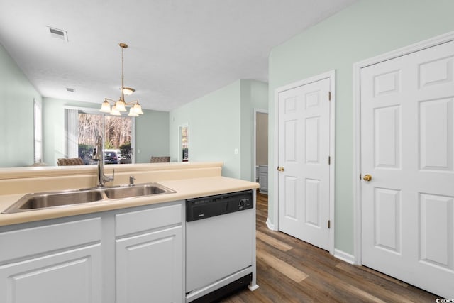 kitchen featuring dark hardwood / wood-style flooring, white dishwasher, a chandelier, white cabinetry, and hanging light fixtures