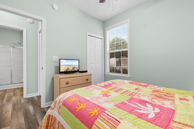 bedroom featuring dark hardwood / wood-style flooring, a closet, and ceiling fan