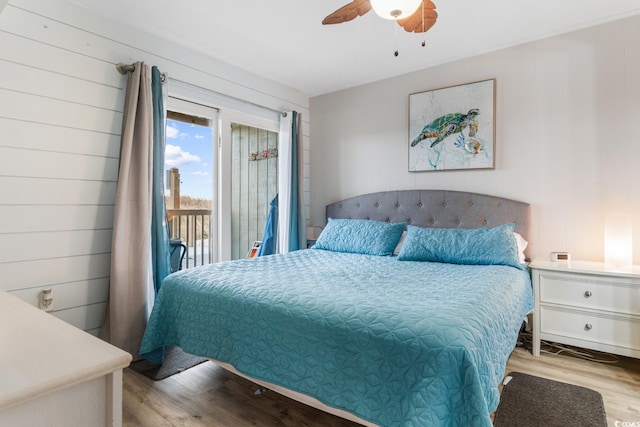 bedroom with ceiling fan, access to outside, and light hardwood / wood-style flooring