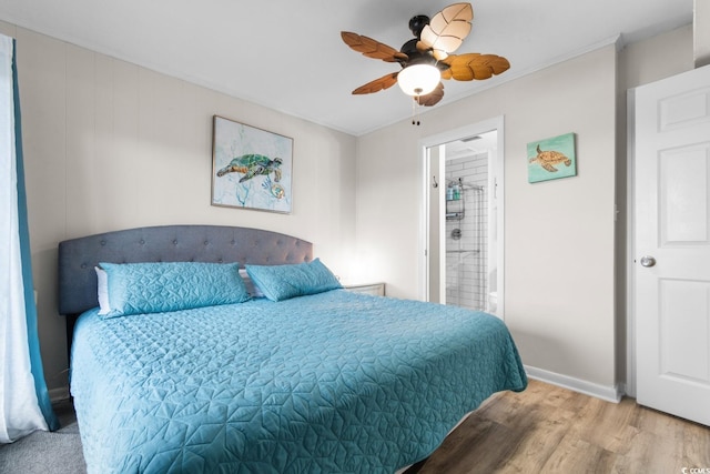 bedroom with ceiling fan, light hardwood / wood-style floors, crown molding, and connected bathroom