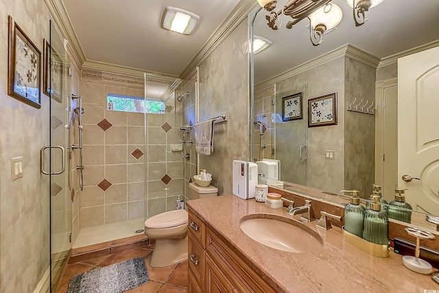 bathroom featuring tile patterned flooring, vanity, an enclosed shower, and crown molding