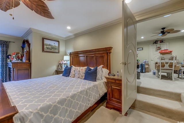 carpeted bedroom with ceiling fan and crown molding