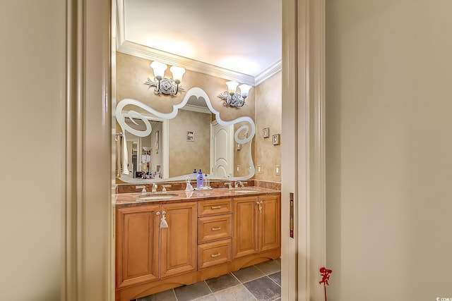 bathroom with crown molding and vanity