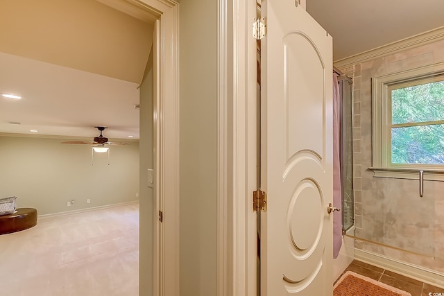 bathroom with tile patterned floors and ceiling fan