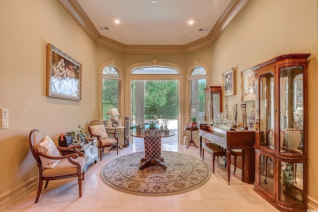 sitting room featuring light tile patterned floors and ornamental molding