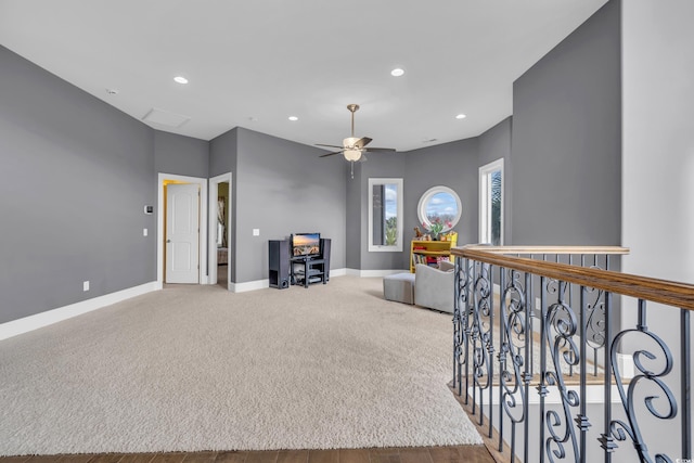 interior space with ceiling fan and hardwood / wood-style floors