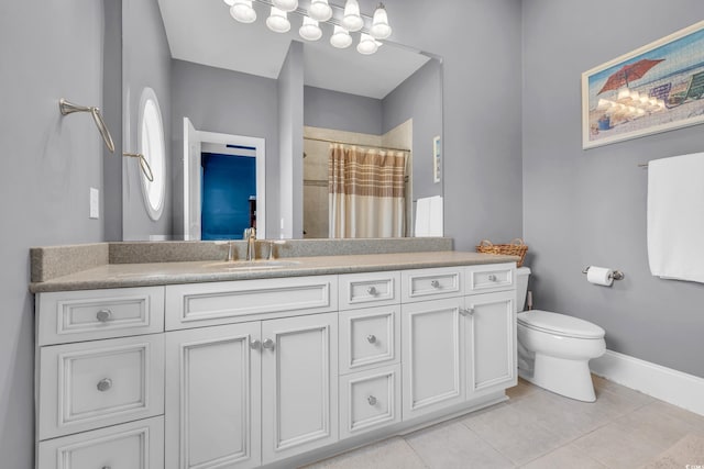 bathroom featuring toilet, a shower with curtain, vanity, and tile patterned floors