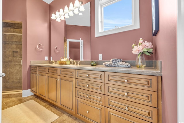 bathroom with vanity, tile patterned floors, and a shower with shower door