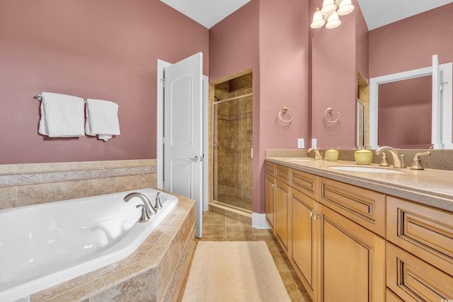 bathroom with tile patterned flooring, vanity, and independent shower and bath