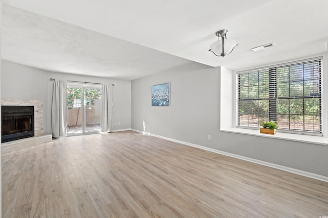 unfurnished living room with light hardwood / wood-style flooring