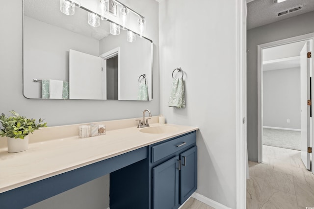 bathroom featuring vanity and a textured ceiling