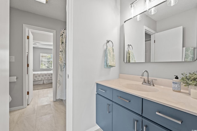 bathroom featuring vanity and a textured ceiling