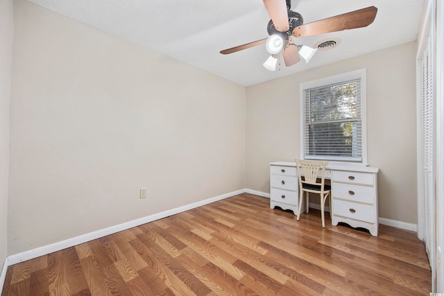 unfurnished office featuring ceiling fan and light hardwood / wood-style flooring