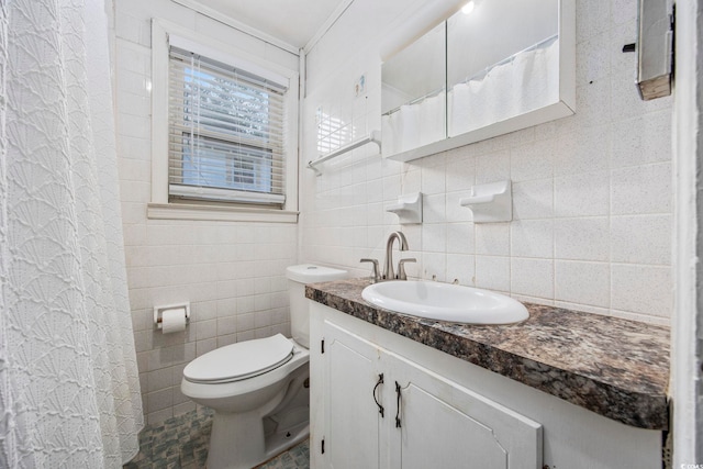 bathroom with vanity, toilet, tile walls, and backsplash