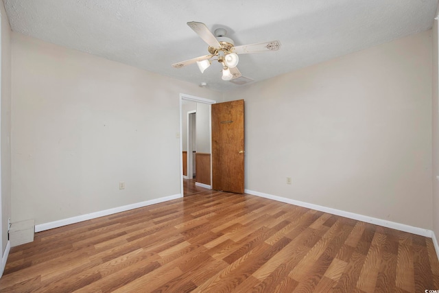 unfurnished room featuring ceiling fan and light wood-type flooring