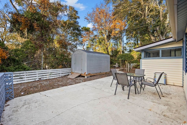 view of patio / terrace featuring a storage unit