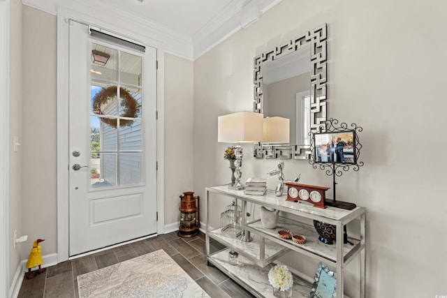 entrance foyer with dark hardwood / wood-style flooring and ornamental molding