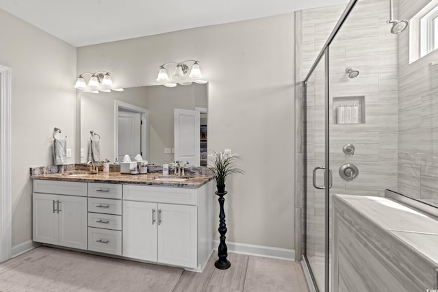 bathroom featuring vanity and walk in shower