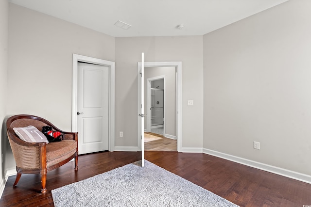 sitting room with dark hardwood / wood-style floors