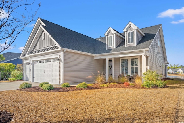 view of front of house with a front yard and a garage