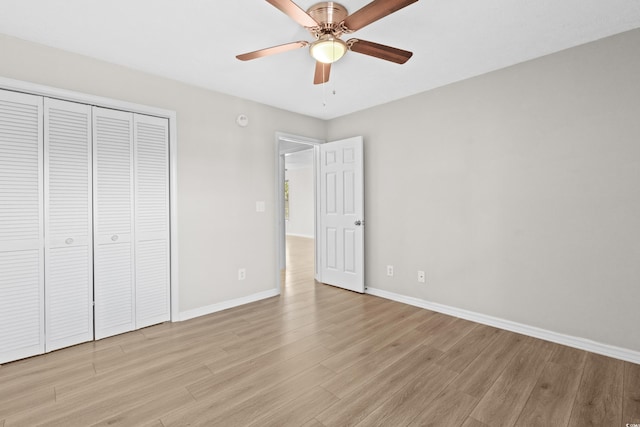 unfurnished bedroom with a closet, ceiling fan, and light hardwood / wood-style flooring