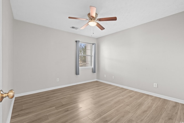 empty room with light hardwood / wood-style flooring