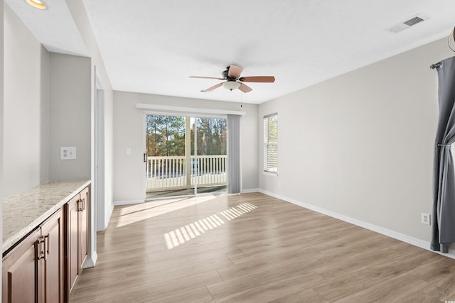 interior space featuring ceiling fan and light hardwood / wood-style floors