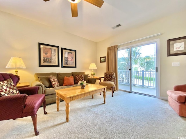 carpeted living room featuring ceiling fan