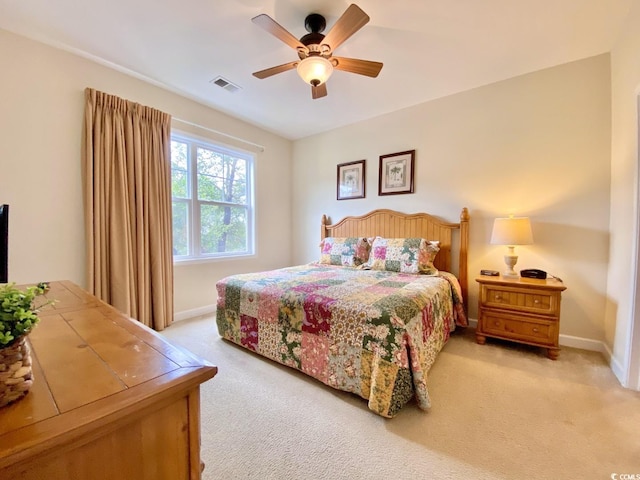 bedroom featuring ceiling fan and light colored carpet