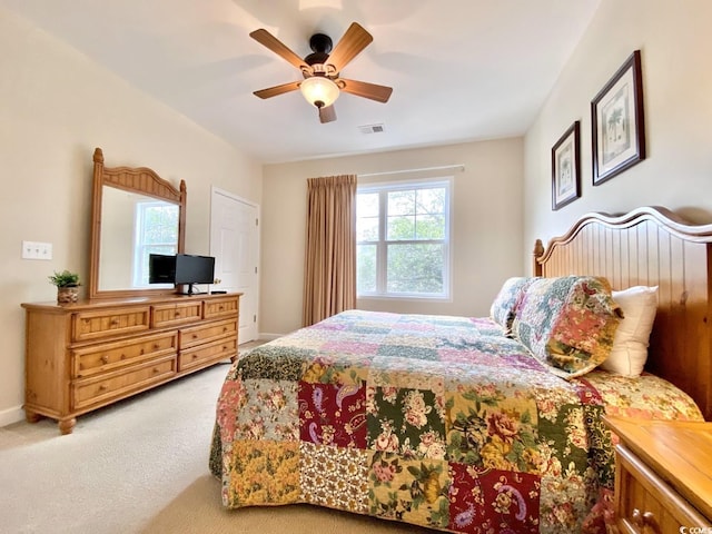 carpeted bedroom with ceiling fan