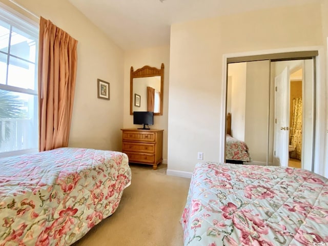 carpeted bedroom featuring a closet