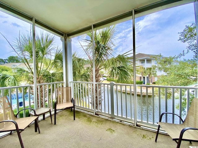 sunroom with a water view