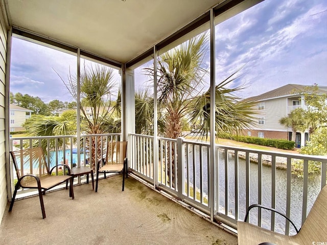 balcony featuring a water view