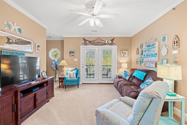 living room with ceiling fan, light colored carpet, and crown molding