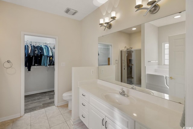 full bathroom with tile patterned flooring, vanity, toilet, and independent shower and bath