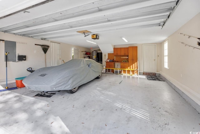 garage featuring electric panel and a garage door opener