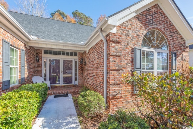 view of exterior entry featuring french doors