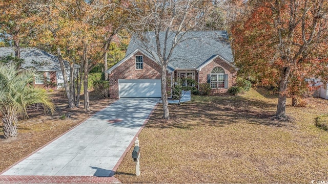 view of front of house with a front yard and a garage