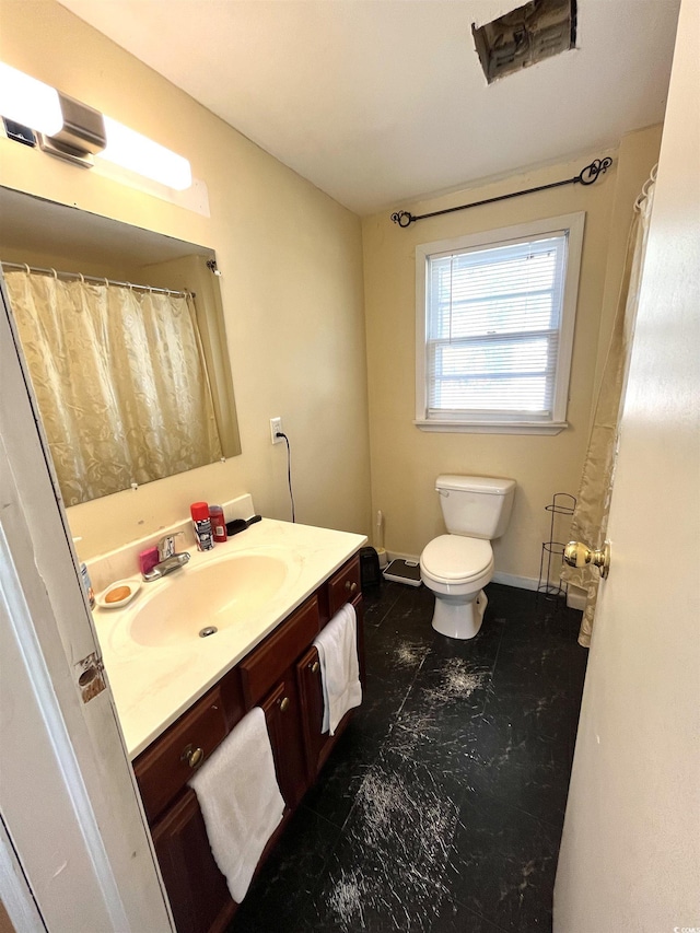 bathroom with vanity and toilet