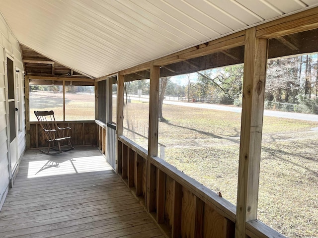 unfurnished sunroom with vaulted ceiling