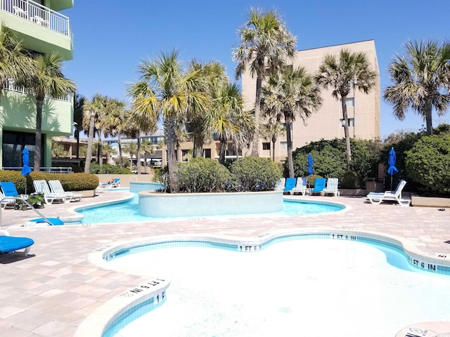 view of swimming pool with a patio area