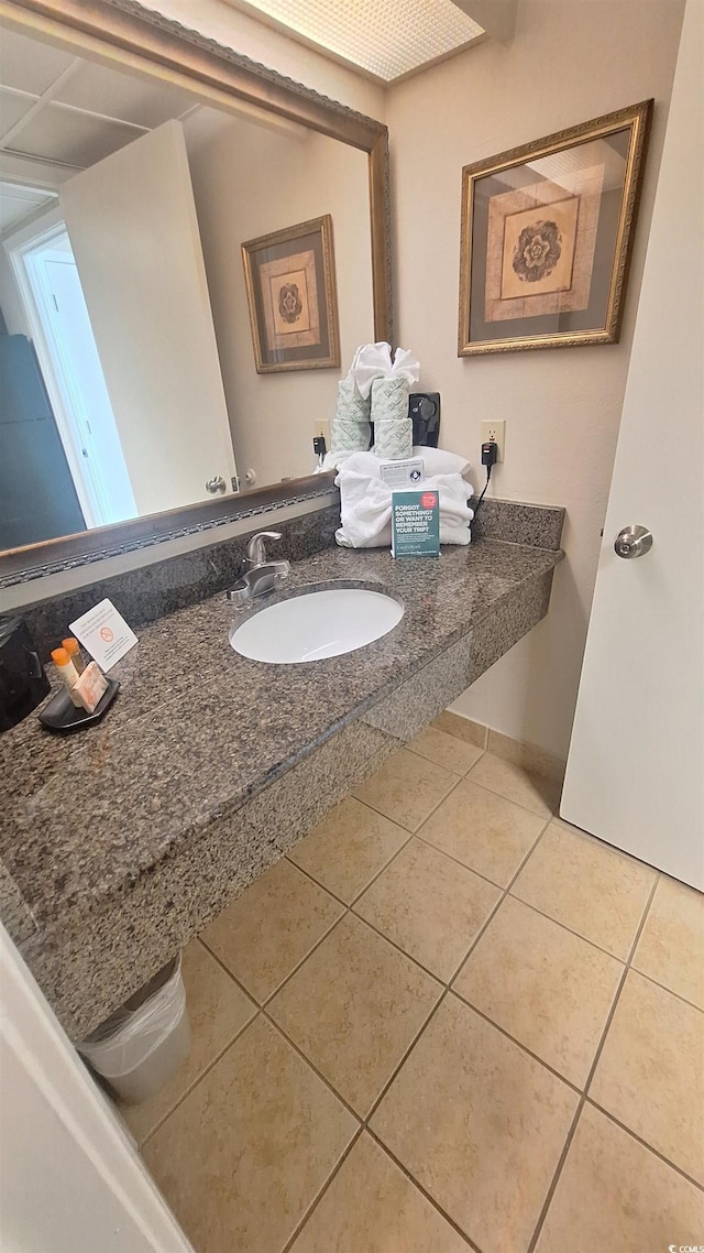 bathroom featuring tile patterned flooring and sink