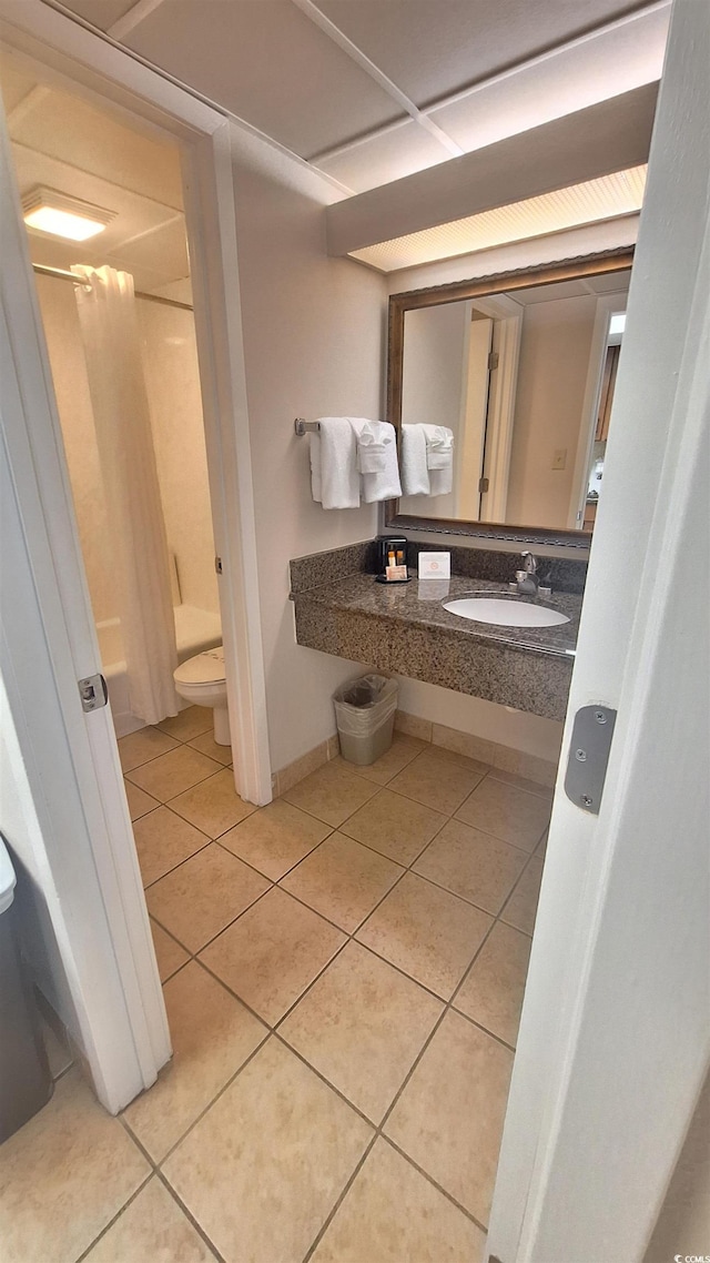 full bathroom with tile patterned flooring, shower / bathing tub combination, vanity, and toilet