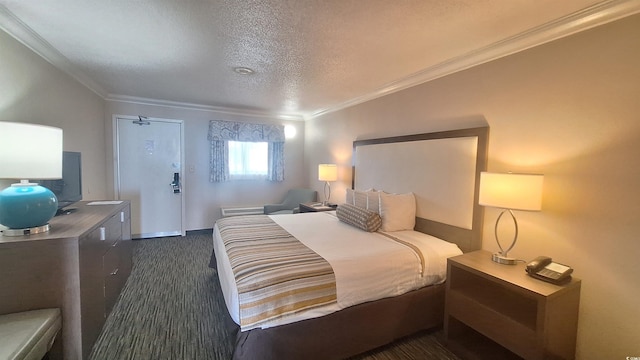 bedroom with ornamental molding, a textured ceiling, and dark colored carpet